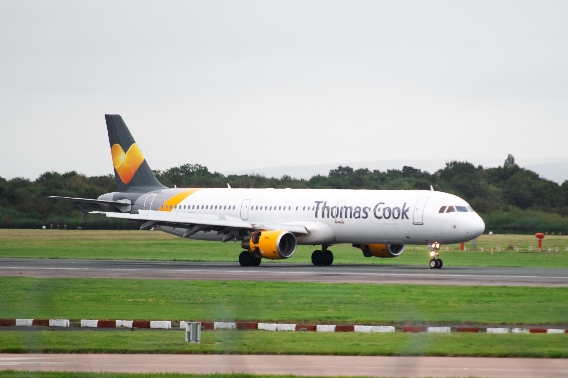 A Thomas Cook plane lands.